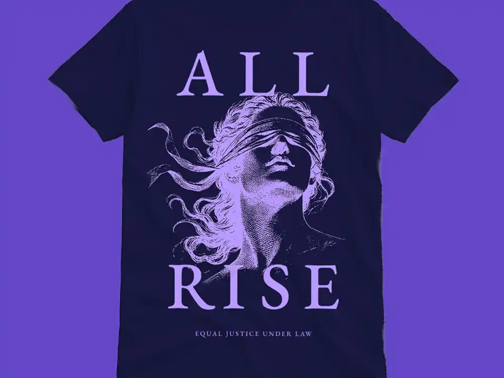Navy All Rise tee with a blindfolded Lady Justice and Equal Justice Under Law, from Lambda Legal's All Rise campaign