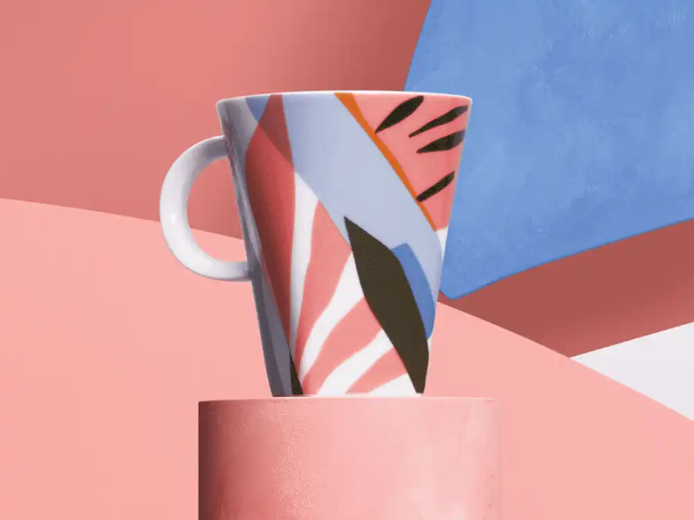 Abstract pink, blue, and black mug on a pink pedestal, from Nespresso's Innovation You Can Taste