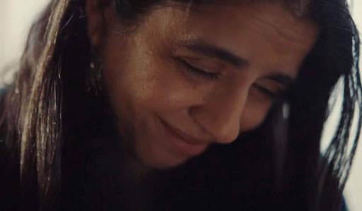 Avni Gupta-Kagan smiles softly in a close-up scene from Letters of Love